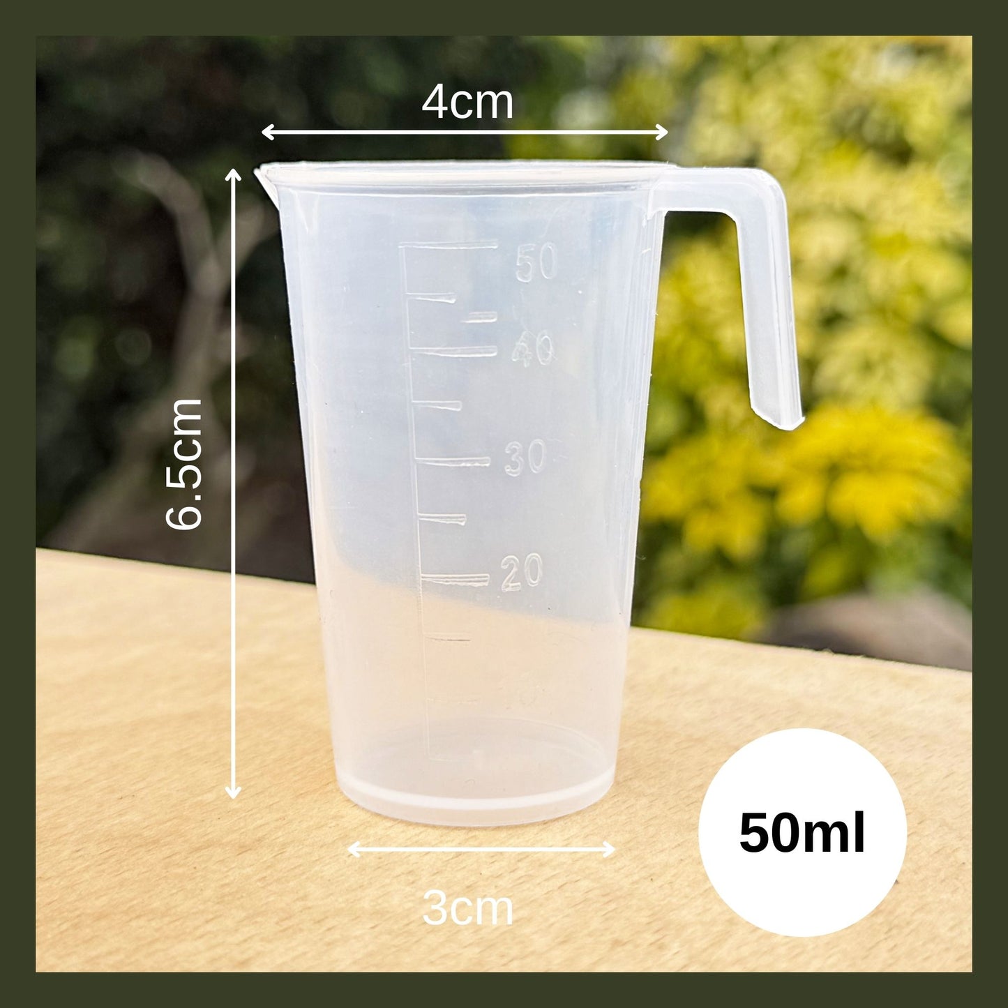 Clear BPA-free Tritan plastic 50 mL measuring jug with ergonomic handle and deep-etched volume markings