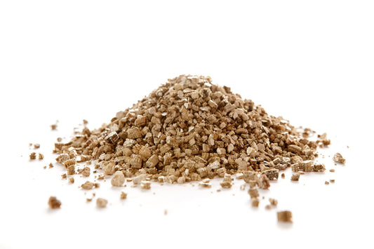 Pile of coarse grade vermiculite on white background, ideal for plant compost and potting mixes