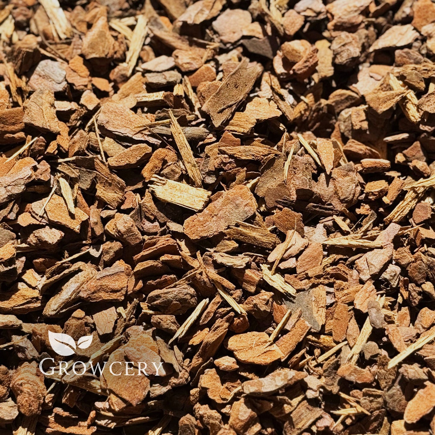 Top view of loose orchid bark mulch, perfect for repotting orchids, garden bark applications, and plant drainage.