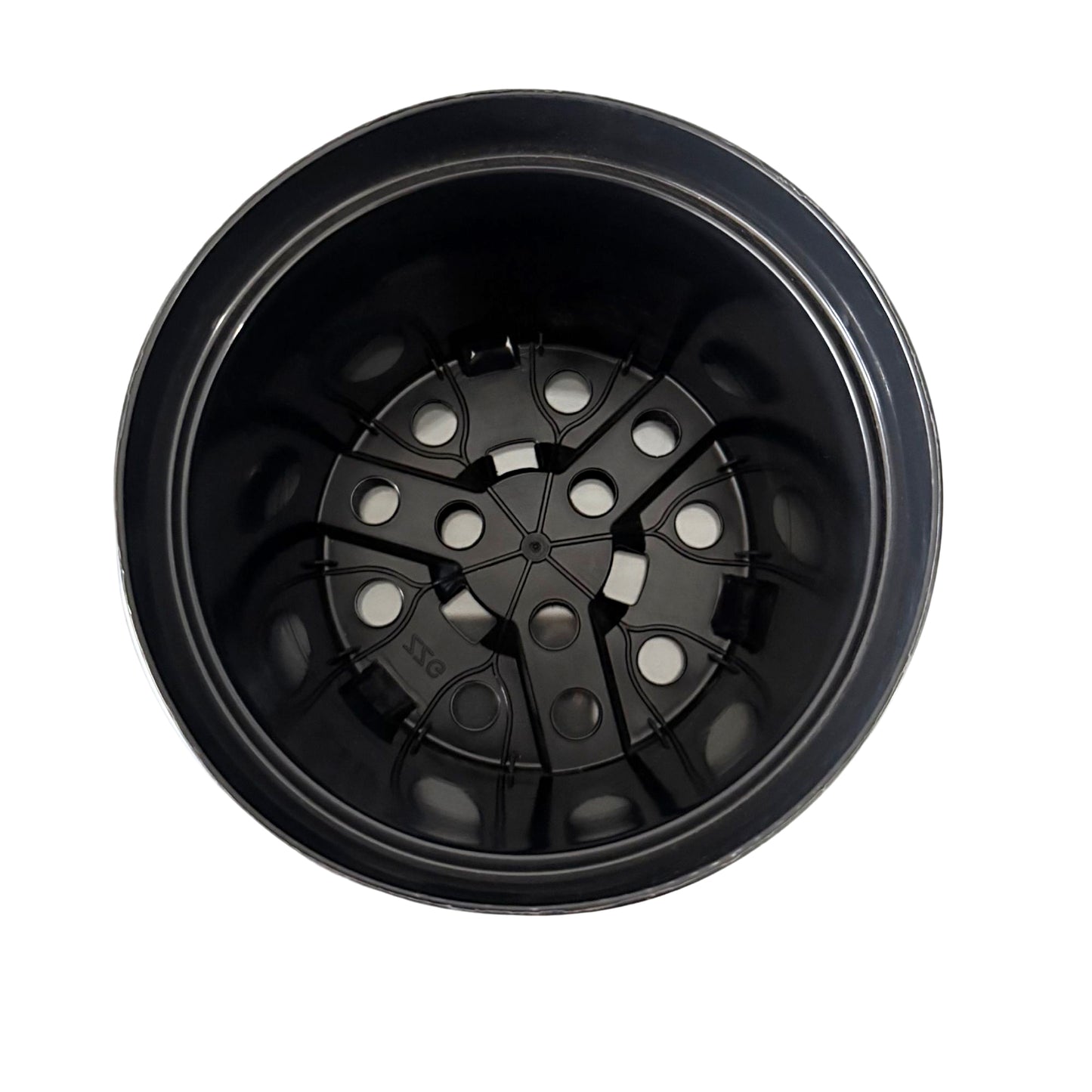 Top view of round nursery pot showing multiple drainage holes
