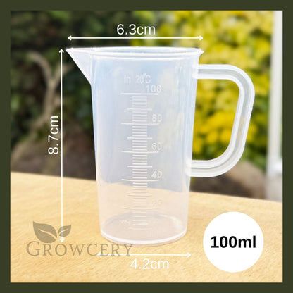 Transparent 100 mL Tritan measuring jug, BPA-free, with drip-free spout and permanent metric graduations.