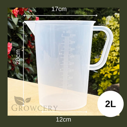 2 L clear plastic measuring jug, BPA-free Tritan, featuring drip-free spout, ergonomic design, and deep-etched graduations