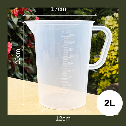 2 L clear plastic measuring jug, BPA-free Tritan, featuring drip-free spout, ergonomic design, and deep-etched graduations