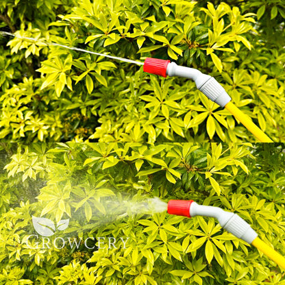 Yellow spray lance with adjustable red-tipped nozzle delivering targeted jet spray on green foliage