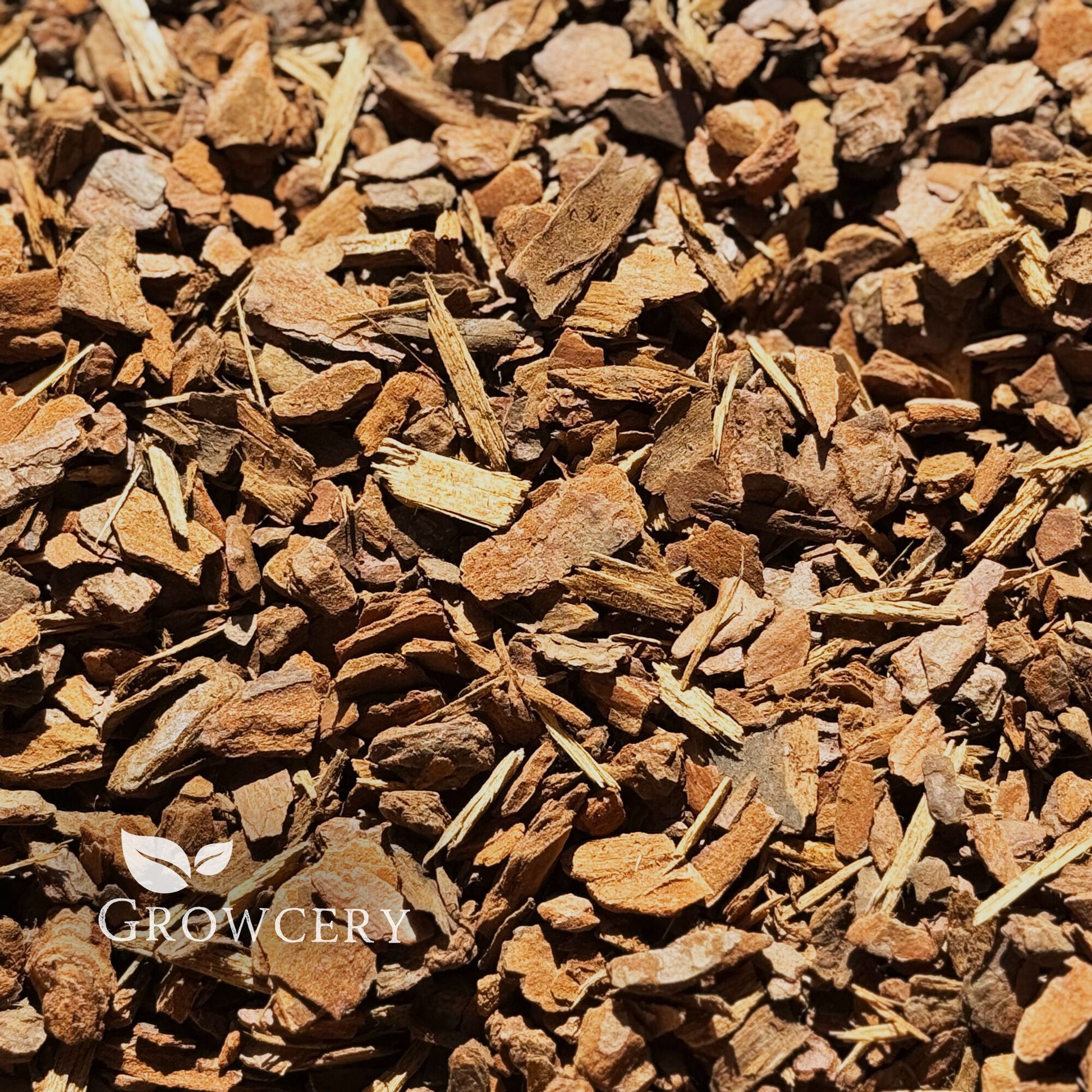 Top view of loose orchid bark mulch, perfect for repotting orchids, garden bark applications, and plant drainage.