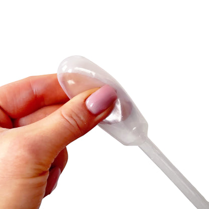 Close-up of flexible squeeze bulb on clear plastic dropper