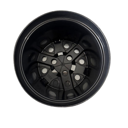Top view of round nursery pot showing multiple drainage holes