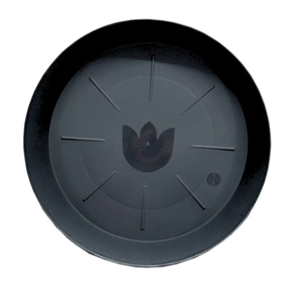 Top view of black plastic plant saucer with drainage lines